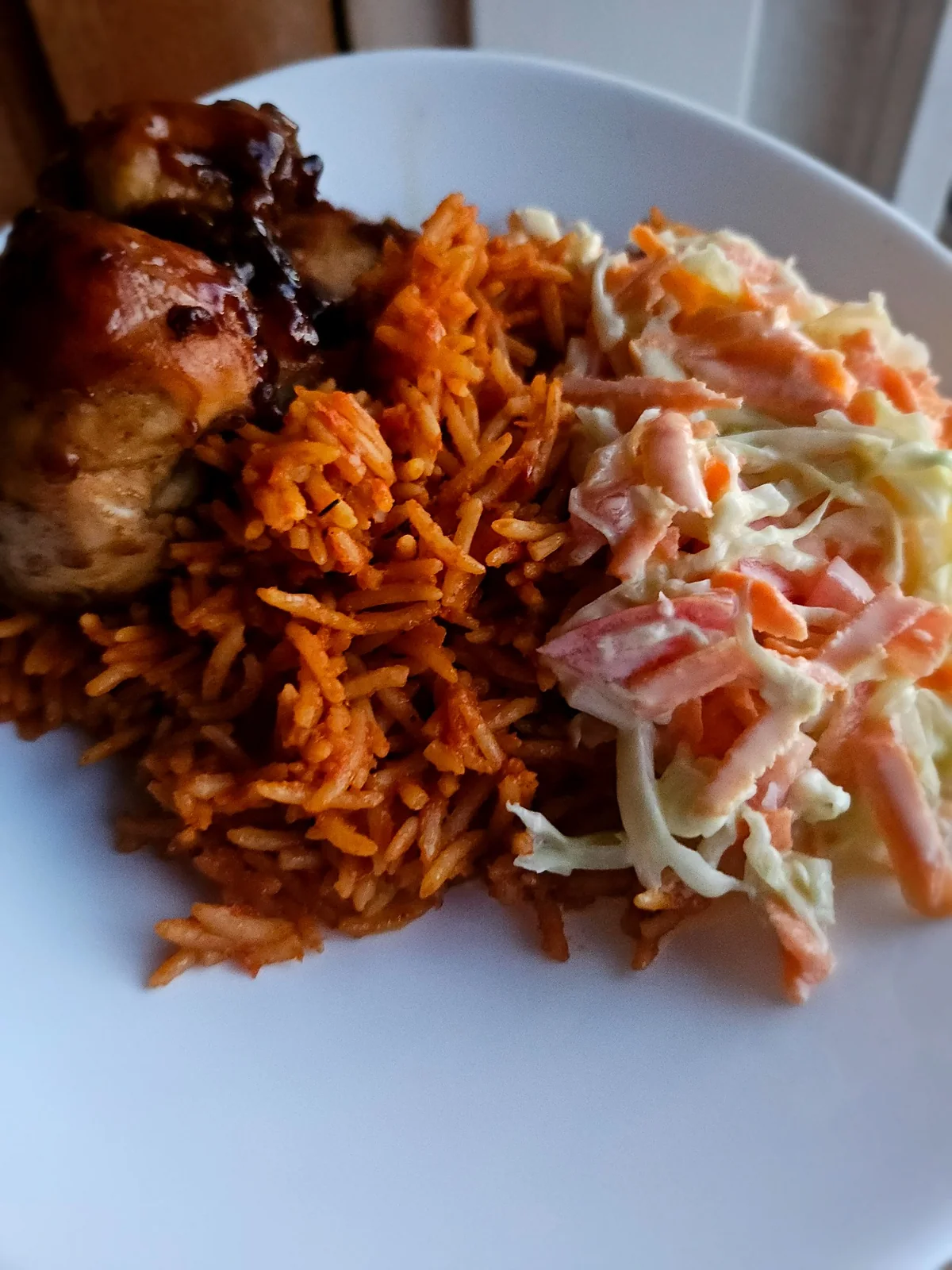 Jollof rice and sides prepared by Nia Bloom Bakes